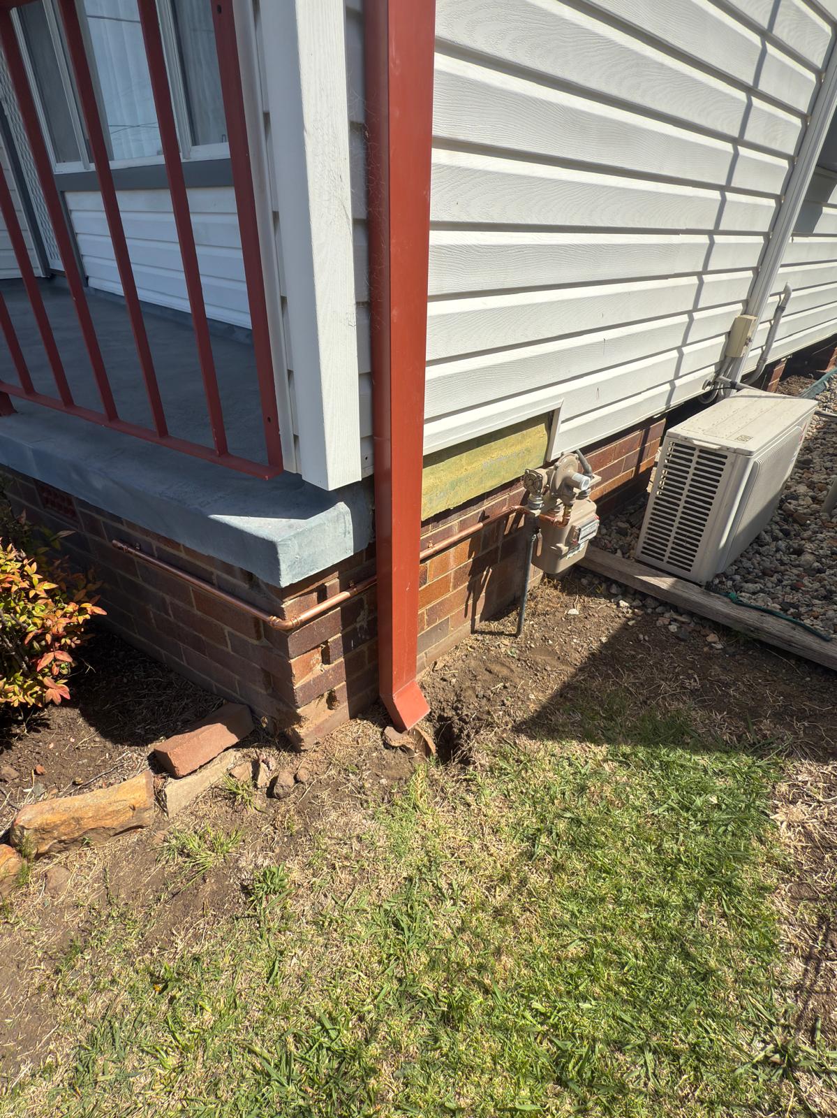 Downpipe & gas meter relocation — plumbing work completed in Albion Park by Shellharbour Plumbing (licensed Illawarra plumber)