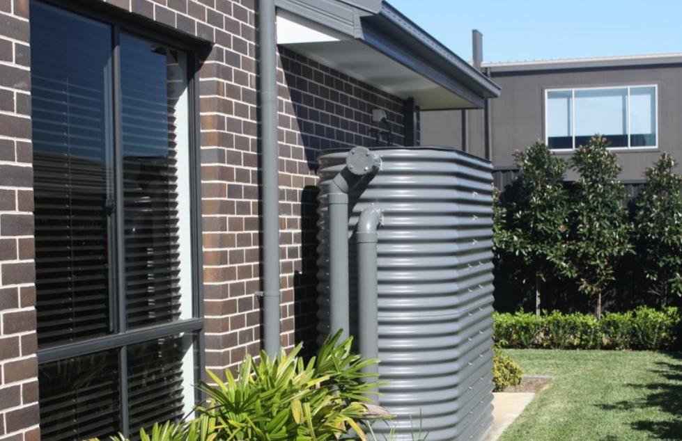 Slimline rainwater tank — side yard — Roof Plumbing plumbing job in Albion Park by a licensed Shellharbour plumber