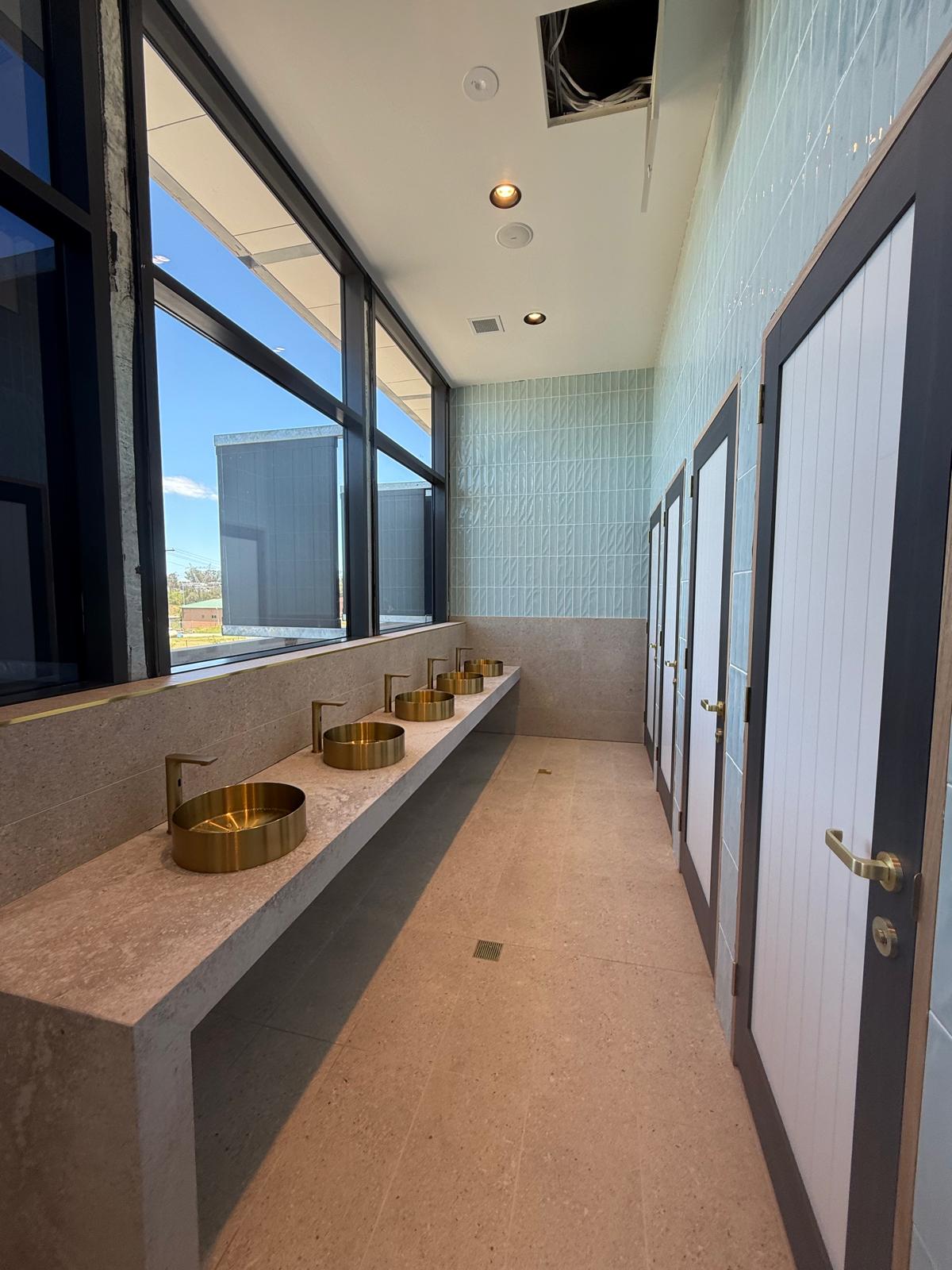Brushed brass public amenities — Commercial Plumbing plumbing job in Flinders by a licensed Shellharbour plumber