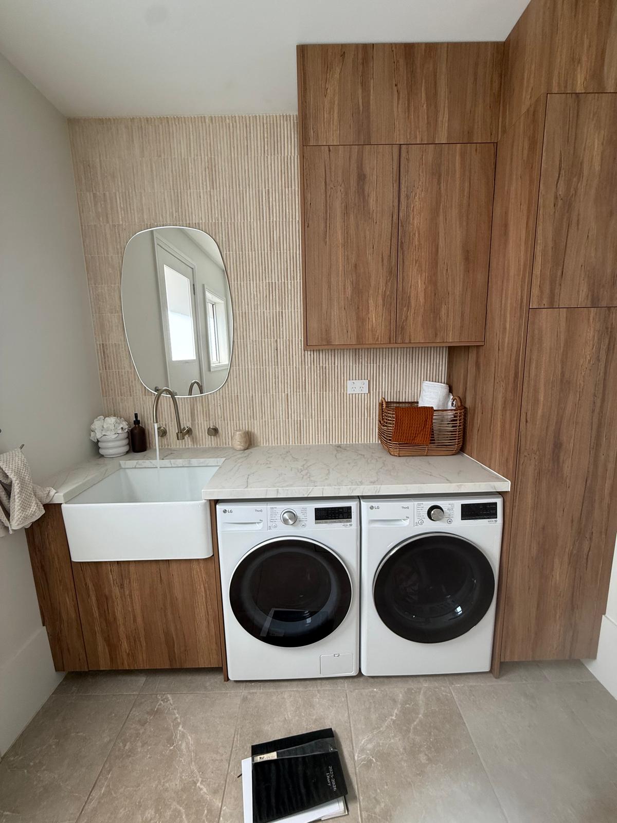 New laundry — farmhouse sink & timber joinery — plumbing work completed in Shell Cove by Shellharbour Plumbing (licensed Illawarra plumber)