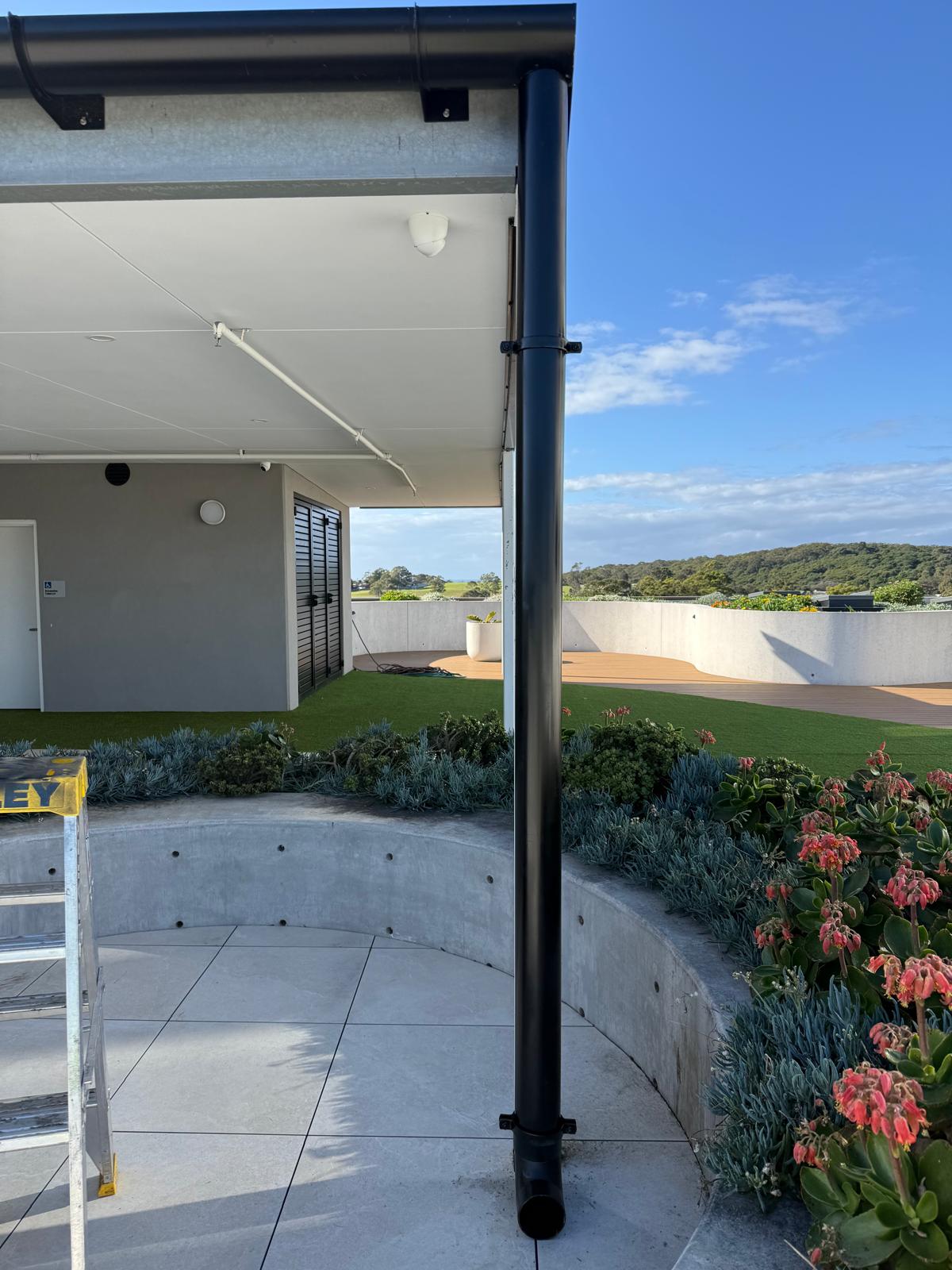 Rooftop terrace — downpipe install — plumbing work completed in Shell Cove by Shellharbour Plumbing (licensed Illawarra plumber)