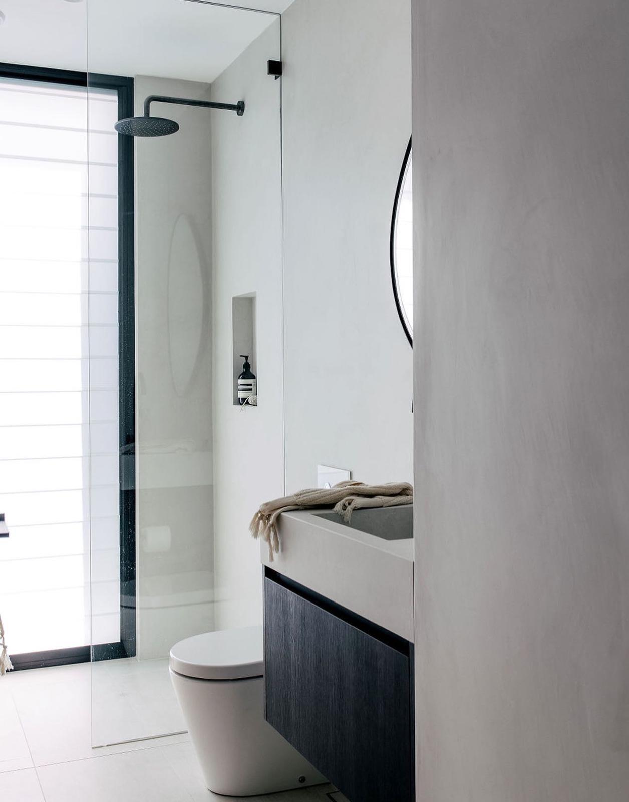 Microcement walk-in ensuite — plumbing work completed in Shell Cove by Shellharbour Plumbing (licensed Illawarra plumber)