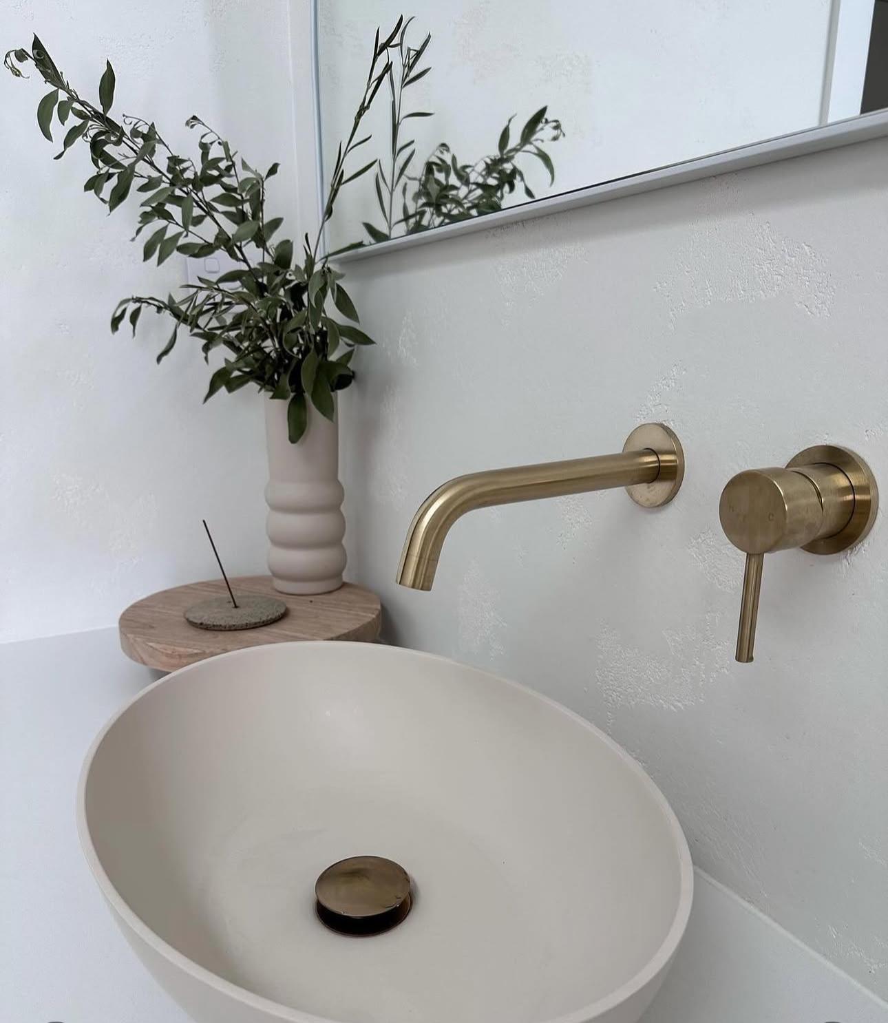 Brushed brass wall-mount basin set — plumbing work completed in Albion Park by Shellharbour Plumbing (licensed Illawarra plumber)