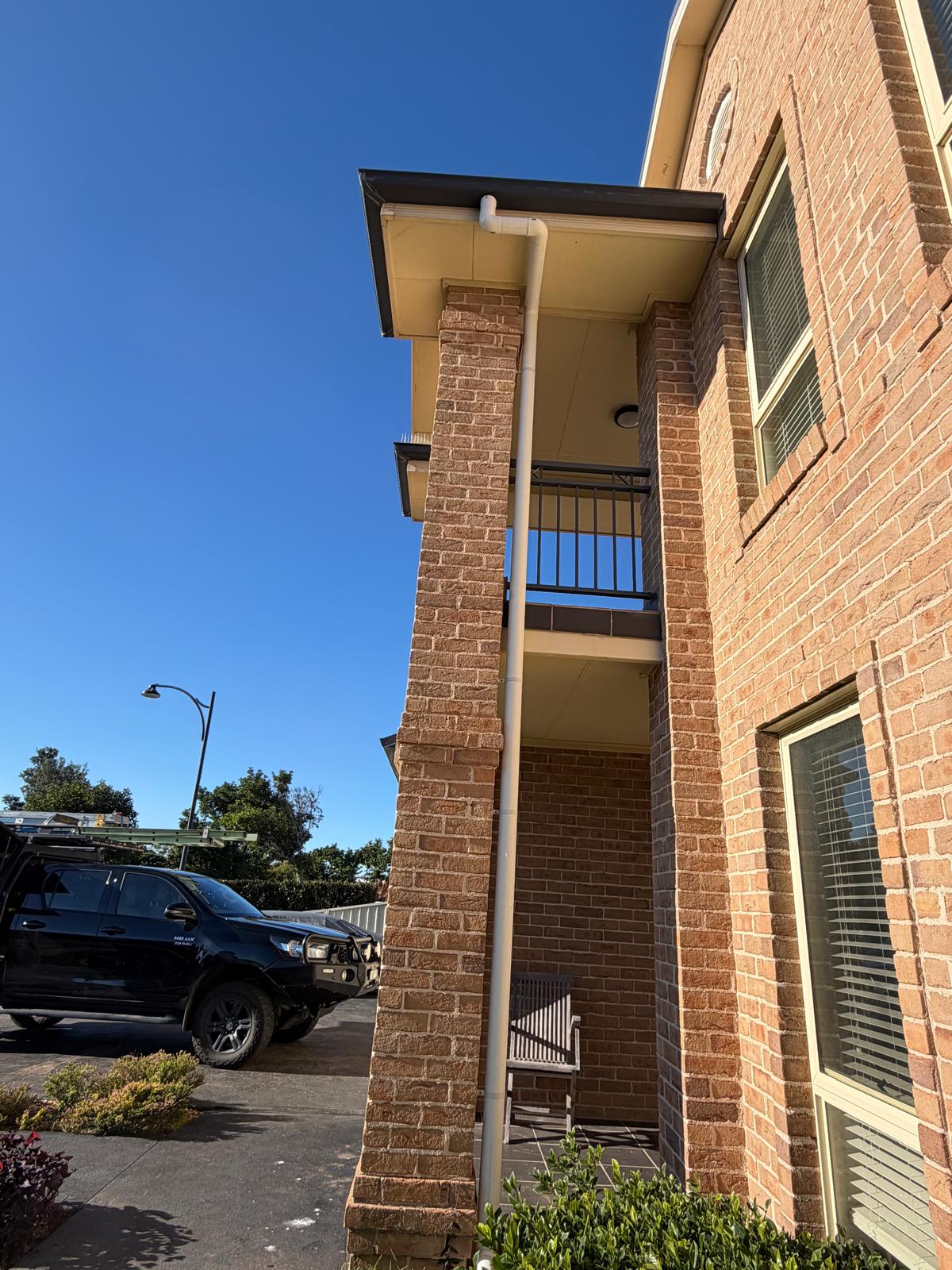 Two-storey downpipe replacement — brick façade — Roof Plumbing plumbing job in Flinders by a licensed Shellharbour plumber