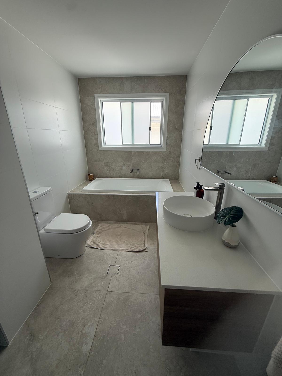 Main bathroom — inset bath & vessel basin — plumbing work completed in Shell Cove by Shellharbour Plumbing (licensed Illawarra plumber)