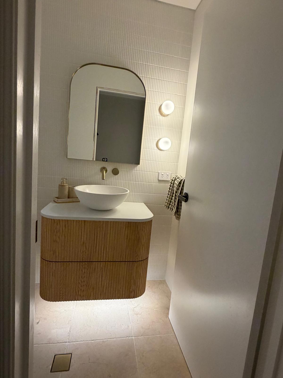 Powder room — fluted vanity & vessel basin — plumbing work completed in Gerringong by Shellharbour Plumbing (licensed Illawarra plumber)