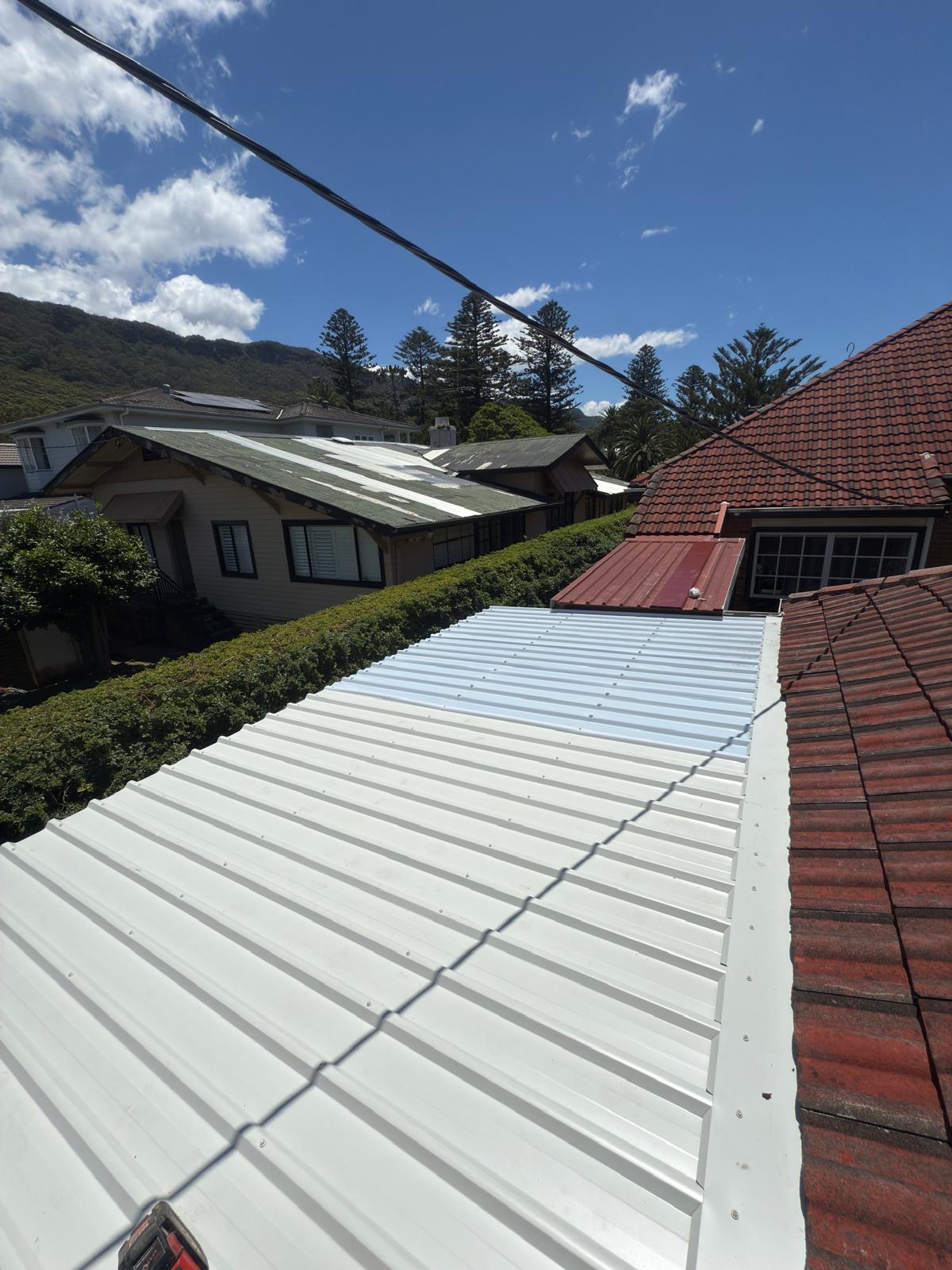 Colorbond patio re-roof — escarpment views — plumbing work completed in Thirroul by Shellharbour Plumbing (licensed Illawarra plumber)
